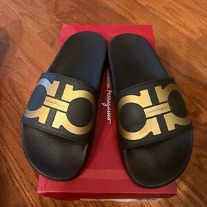 New with box Salvatore Ferragamo Black and Gold Slides